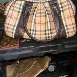 Burberry Haymarket Purse. I need to make $300, so negotiate away.